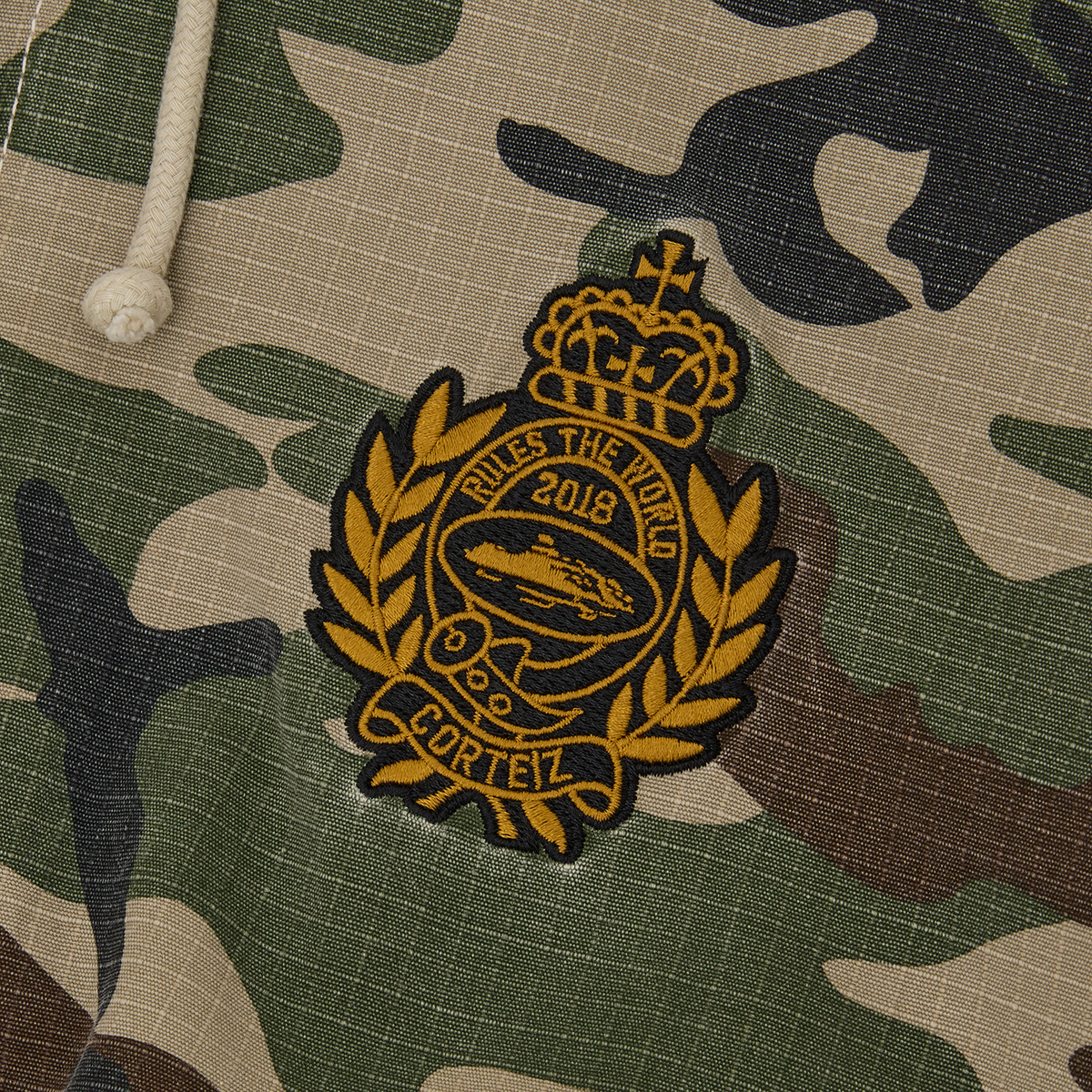 EMBLEM RIPSTOP JACKET [WOODLAND CAMO]